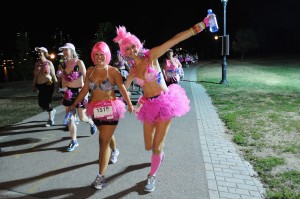 NEW YORK, NY - JULY 20:  Participants attend the first-ever MoonWalk NYC at Randall's Island on July 20, 2013 in New York City.  (Photo by Bryan Bedder/Getty Images for Walk the Walk)