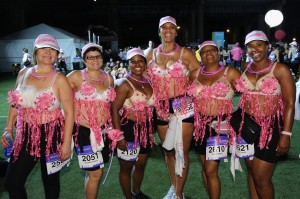 NEW YORK, NY - JULY 20:  Participants pose together at the first-ever MoonWalk NYC at Randall's Island on July 20, 2013 in New York City.  (Photo by Bryan Bedder/Getty Images for Walk the Walk)