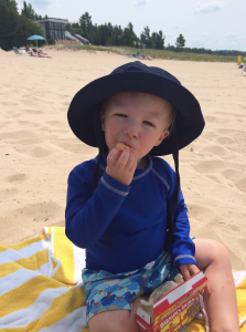 Henry relaxing and enjoying a nice snack on the beach
